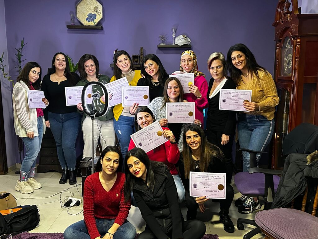 BeePositive Academy graduates holding their certificates
